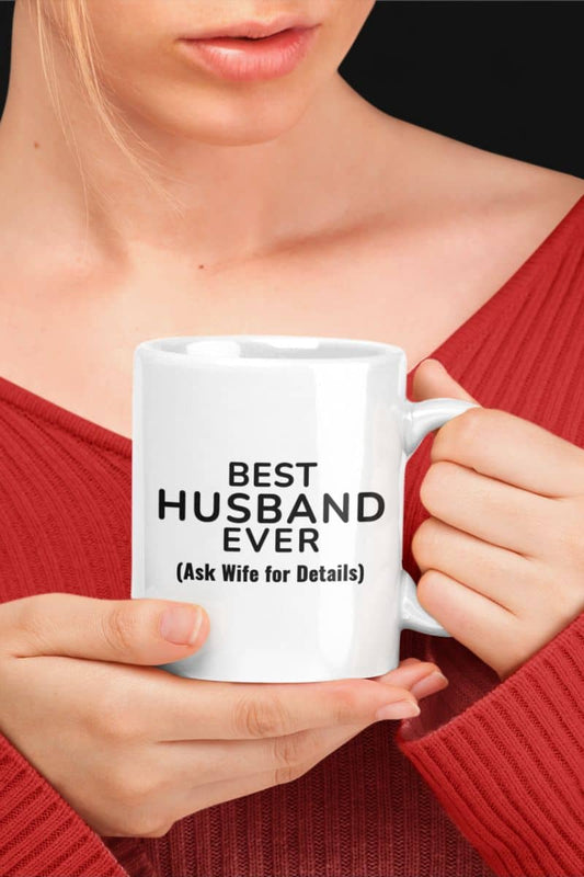 sarcastic mug for him with a person holding a white mug with text 'BEST HUSBAND EVER (Ask Wife for Details)'