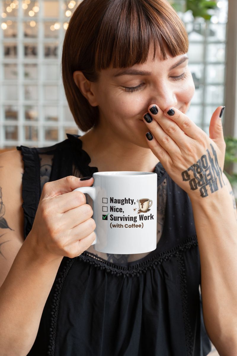 sarcastic work mug with a woman holding a mug with text 'Naughty, Nice, Surviving Work (with Coffee)' and a coffee cup graphic, wearing a black top.