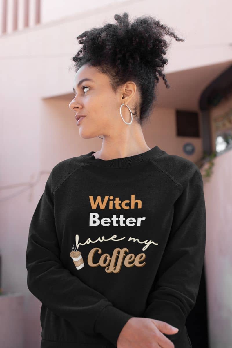 spooky coffee sweater with a person wearing a black sweatshirt with text 'Witch Better Have My Coffee'