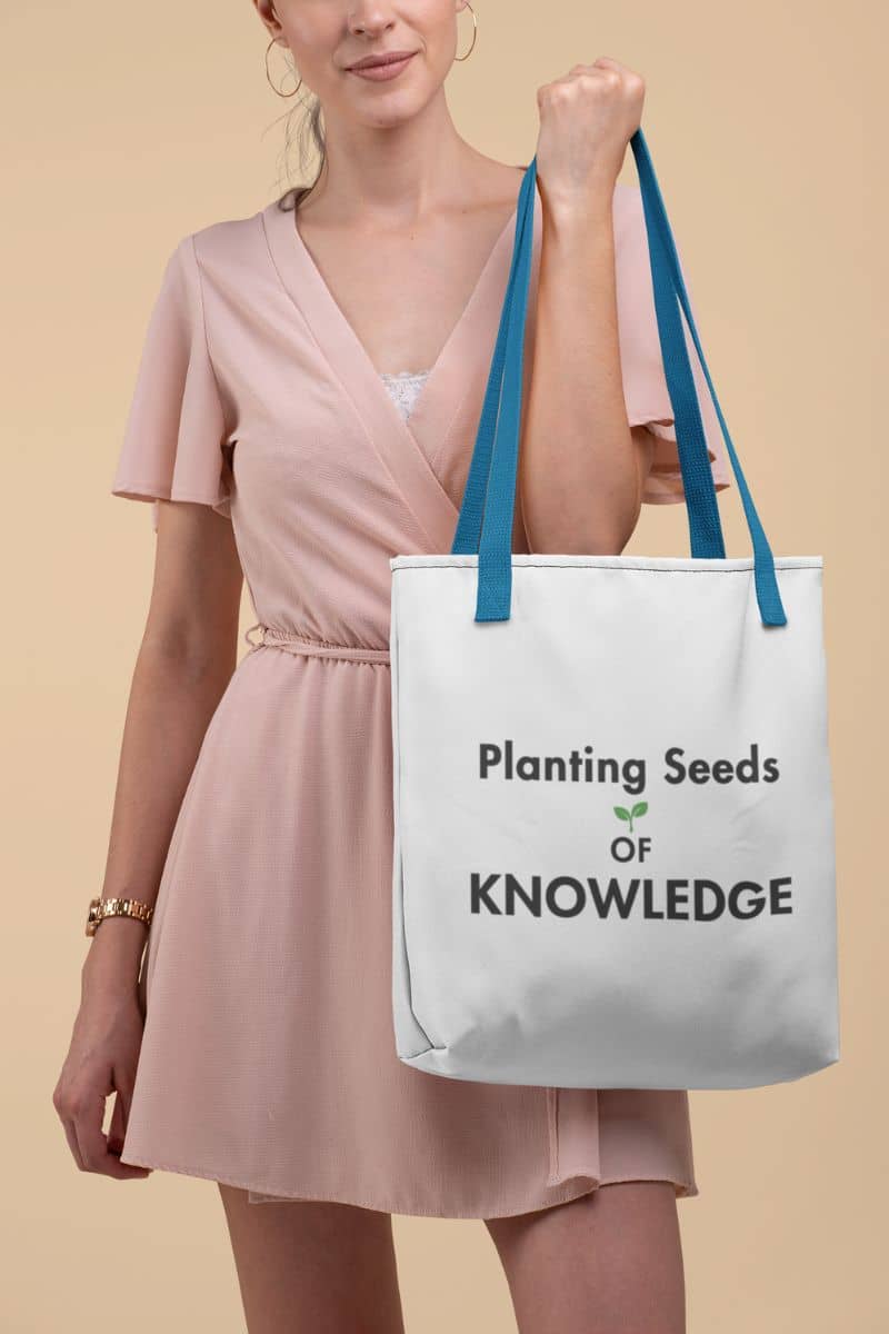 teacher canvas bag with a woman carrying a white canvas tote bag with text 'Planting Seeds OF KNOWLEDGE' 
