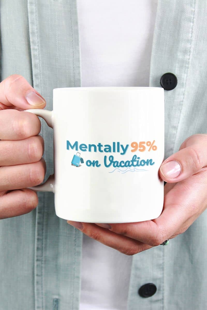 wanderlust coffee mug with a person holding a mug with 'Mentally 95% on Vacation' text
