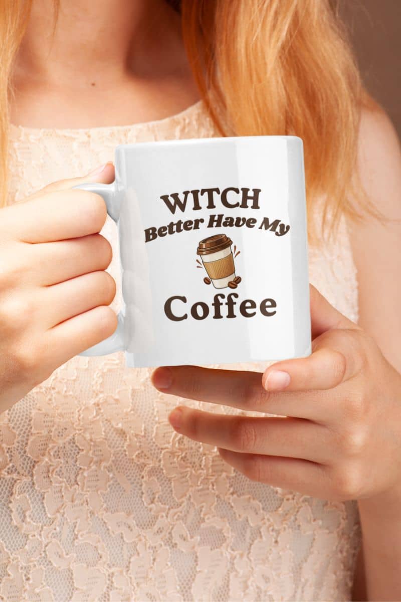 witch coffee mug with a person holding a white ceramic mug with the printed text 'Witch Better Have My Coffee'