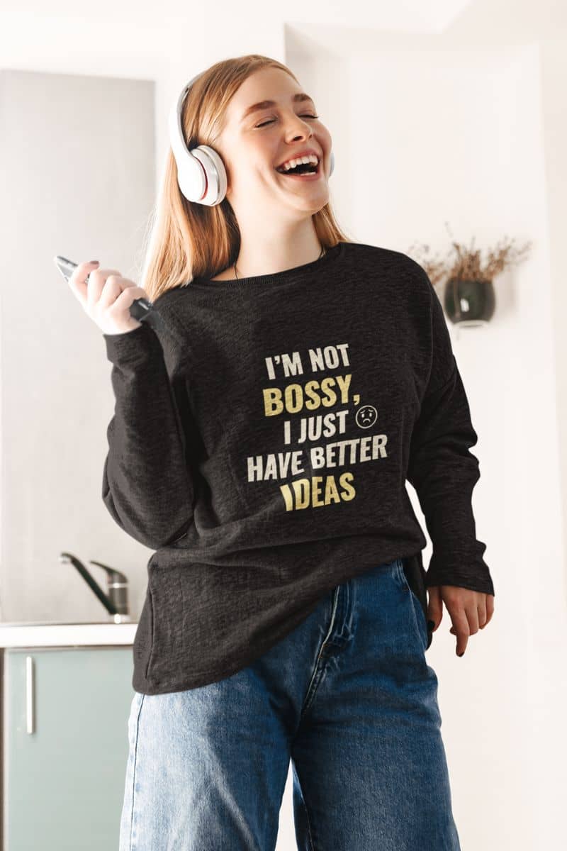 witty quote sweatshirt with a person wearing a sweatshirt with text 'I’m Not Bossy, I Just Have Better Ideas', standing in a kitchen.