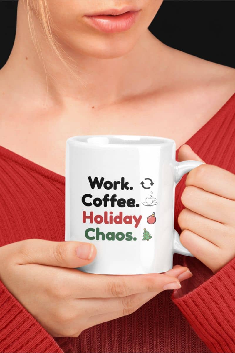 work humor coffee mug with a person holding a white mug with text 'Work. Coffee. Holiday Chaos.'
