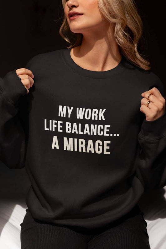 work life balance sweatshirt with a person wearing a black sweatshirt with text 'My Work-Life Balance Is a Mirage' on a dark background