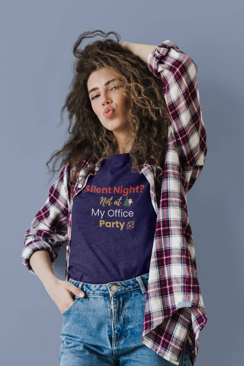 work party outfit with a person wearing a purple t-shirt with text 'Silent Night? Not at My Office Party' and a plaid shirt over it against a gray background