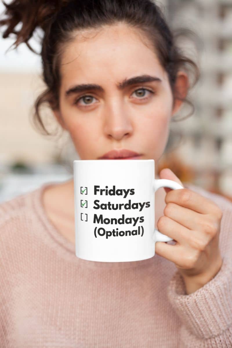 workday humor mug with a person holding a mug with text 'Fridays Saturdays Mondays (Optional)'