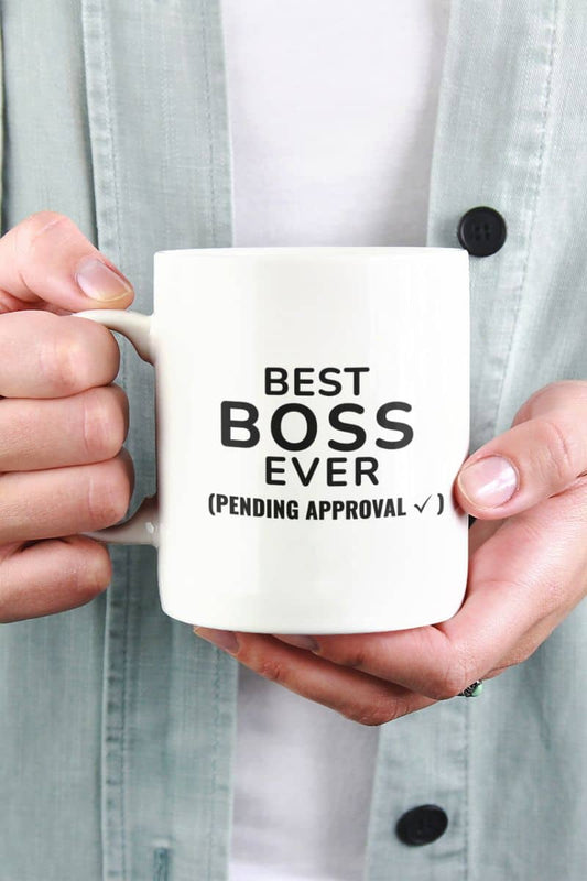 world's greatest boss mug with a person holding a mug with text 'Best Boss Ever (pending approval)'